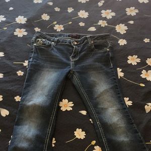 Blue boot cut pants with designs